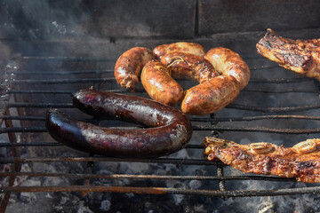 Barbecue, grilled sausages and cow meat , traditional argentine cuisine