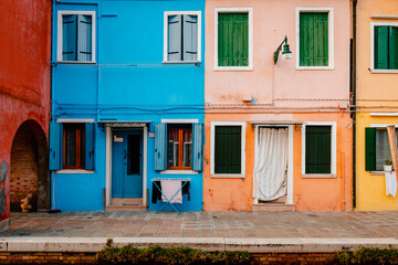 Colorful houses in front of canal in Burano