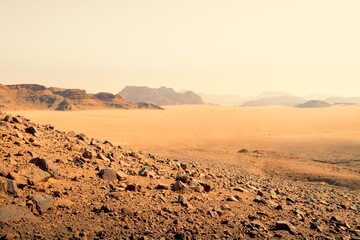 Planet Mars like landscape - Photo of Wadi Rum desert in Jordan with red pink sky above, this location was used as set for many science fiction movies