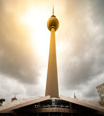 Dramatic sunlight behind Berlin TV tower on Alexanderplatz, Berlin Germany