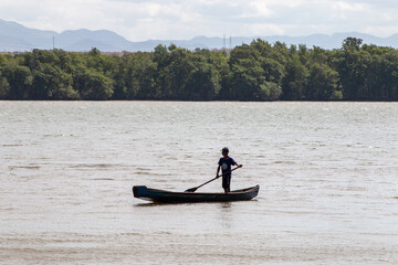 canoe on river, in Vitoria, Espirito Santo, Brazil