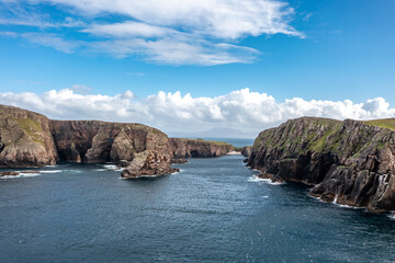 The cliffs and sea stacks at Port Challa on Tory Island, County Donegal, Ireland © Lukassek