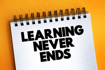 Learning Never Ends text on notepad, concept background