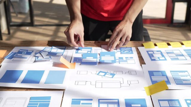 Close up businessman ux designer mobile app design new layout for website.