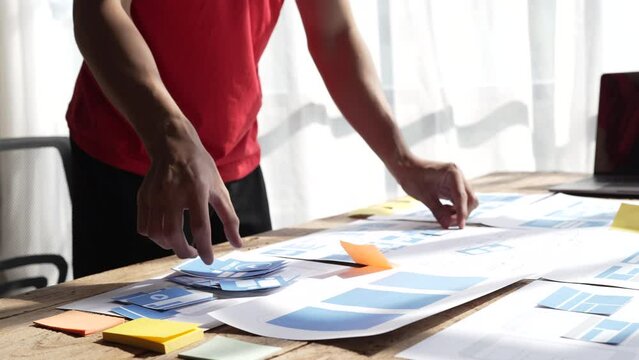 Close up businessman ux designer mobile app design new layout for website.