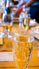 glass of champagne or cava on a table having dinner in a restaurant