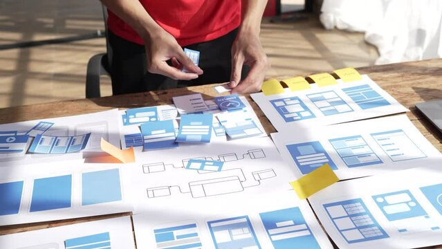 Close up businessman ux designer mobile app design new layout for website.