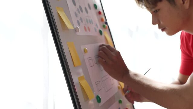 Close up businessman ux designer mobile app design new layout for website.