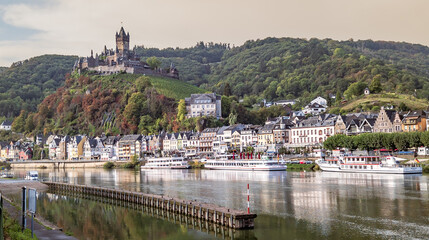 The castle in Cochem on the vineyard on the Moselle. The old town with the pier, Rhineland Palatinate, Germany
