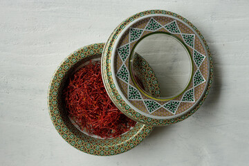 traditional tin can of Iranian saffron