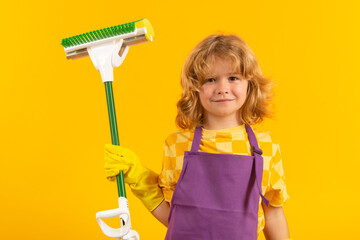 Child doing housework. Child use duster and gloves for cleaning. Funny child mopping house....