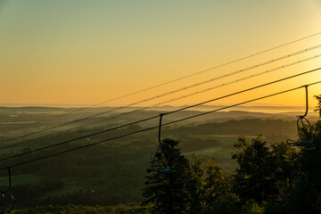 View of the ski slope and the lift at dawn. Wonderful winter mountain morning landscape