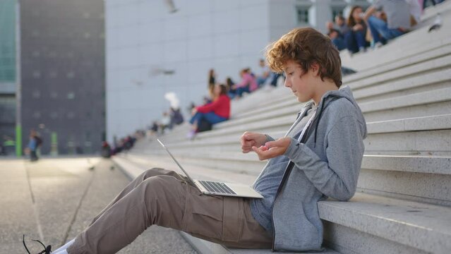 Online learning, distance lesson, education outdoor, technology for schoolboy, business conference. Children doing homework outdoor