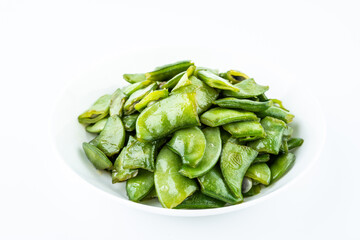Fried lentils in a home-cooked dish on a white background