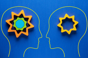 Heads of two people with colourful shapes of abstract brain for concept of idea and teamwork on...