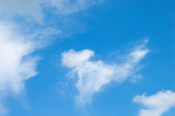 many beautiful white clouds in the sky.