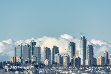 Fototapeta na wymiar Cityscape of Metrotown on winter season. City in foggy winter morning in Canada