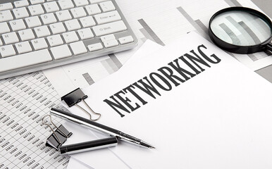 Fototapeta premium NETWORKING text on paper with chart and keyboard, business concept