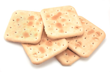 Soda cracker stack closeup, large detailed isolated square crisp whole grain saltine crackers macro closeup, military field ration MRE concept, gentle shadows, perforations, saltines flat lay detail