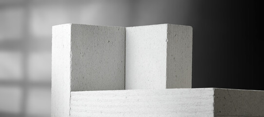 Stone pedestal of free space and wall with shadows 