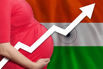 Indian pregnant woman on flag of India background. Birth rate up