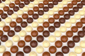 Many rows with different chocolate coated marshmallows
