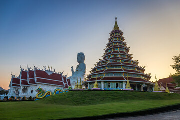 Landscape of Wat Huay Pla Kang, Chinese temple at sunset time in Chiang Rai Thailand, This is the most popular and famous temple in Chiang Rai. - obrazy, fototapety, plakaty