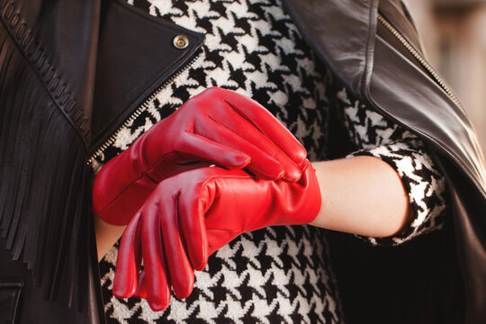 A woman in red gloves