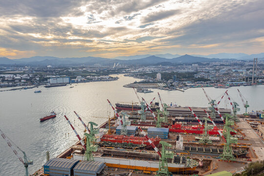 View of the colorful shipyard ocean port and harbor from the Ulsan bridge Observatory in Ulsan South Korea during a golden sunset