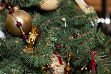 Multi-colored Christmas balls, garlands and toys on the New Year and Christmas tree. Сlose up