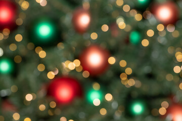 Blurry New Year and Christmas lights and Christmas toys. New Year and Christmas festive bokeh. Abstract background of garlands and Christmas toys
