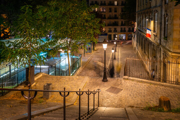 Amazing streets of Montmartre quartier of Paris at night, France