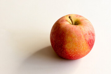 An apple on a color background a white