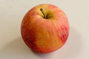 An apple on a color background a white