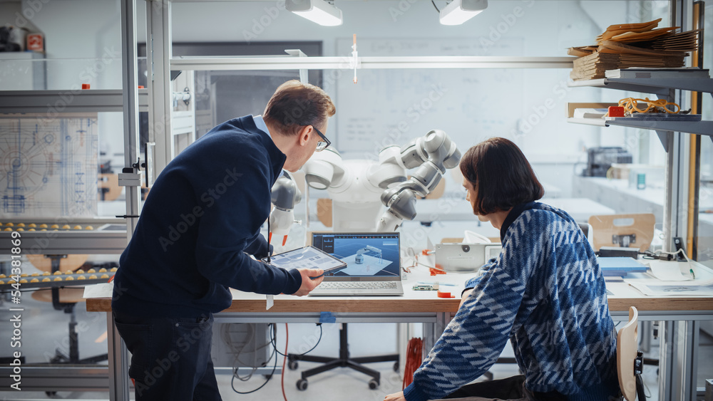 Aufkleber young and promising male computer scientist and his professor use programmable robot hand, manipulat