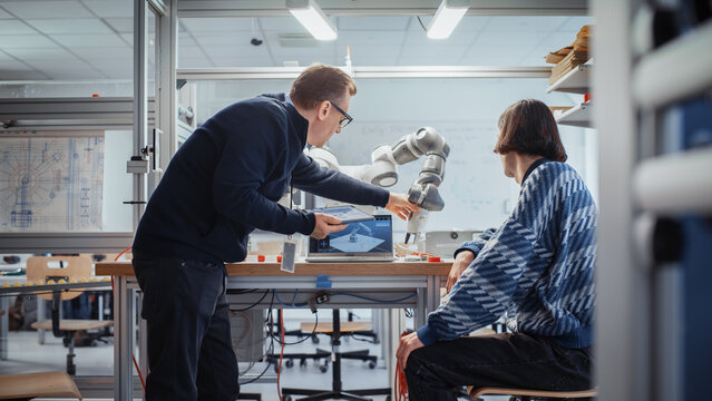 Computer Science Specialist Discuss Optimisation of Autonomous Manufacturing Facility with Chief Engineer and Developing Program for Motion of Robotic Arm. Innovative Startup Company.
