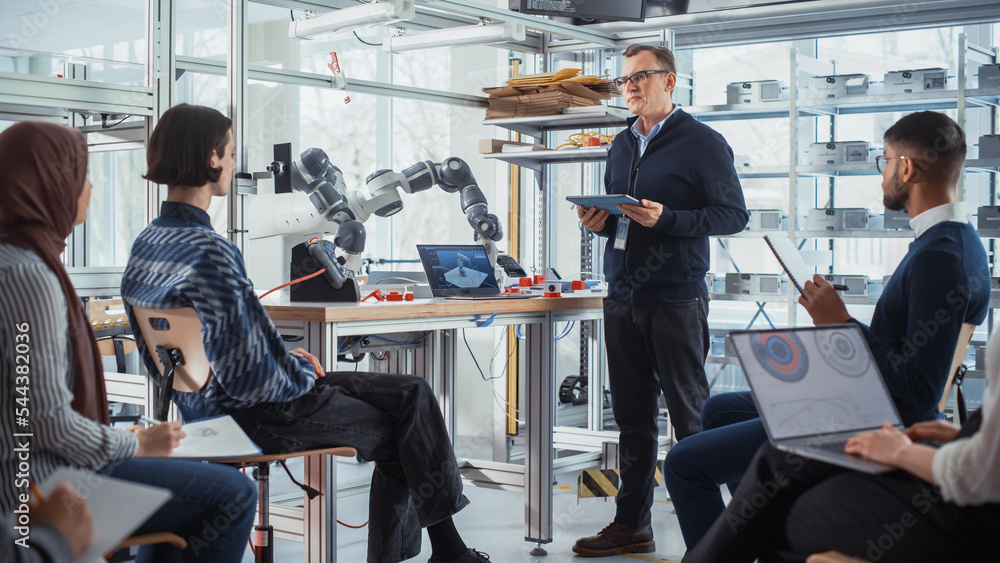 Aufkleber Male Chief Engineer Hosts Meeting with Presentation for a Team of Computer Science Specialists. He Explains Controls of Robot Arm to a Group of Young Scientists. Students Work in Creative Office.