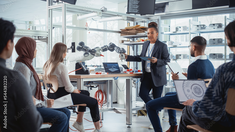 Poster Black Professional Engineer Talks with Future Developers and Explains How to Efficiently Build Machines that Replicate Human Actions, Uses Tablet to Illustrate Working Methods and Solutions.