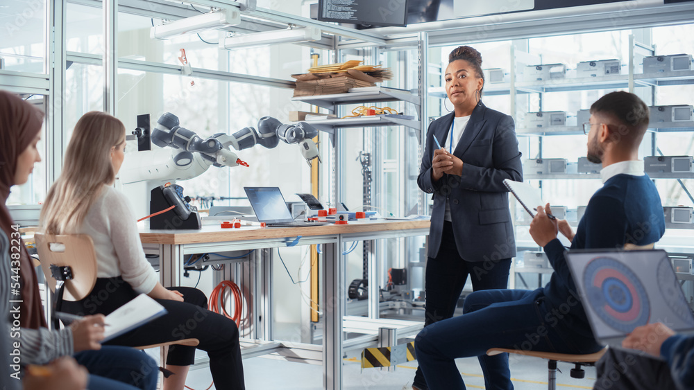Aufkleber Corporate Meeting Room: Confident Black Female Engineer Talk with Intelligent Future Developers about Record Breakthrough in Robotics. Computer Science and Programming for Robotic Arm Concept.