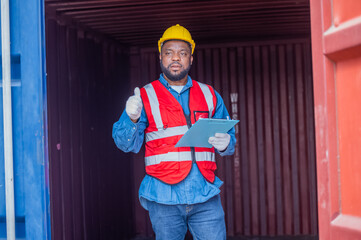 African American worker concept, African American worker working in warehouse containers for...