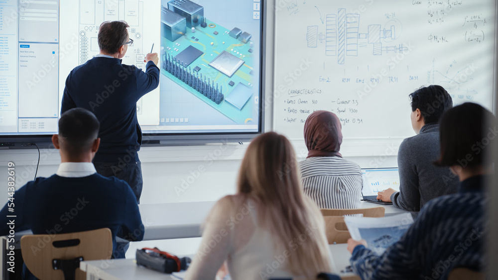 Poster Male Teacher Stands Next to Digital Interactive Whiteboard and Points at Processor During Lesson About Computer Motherboard Components with Group of Diverse Engineering Students.