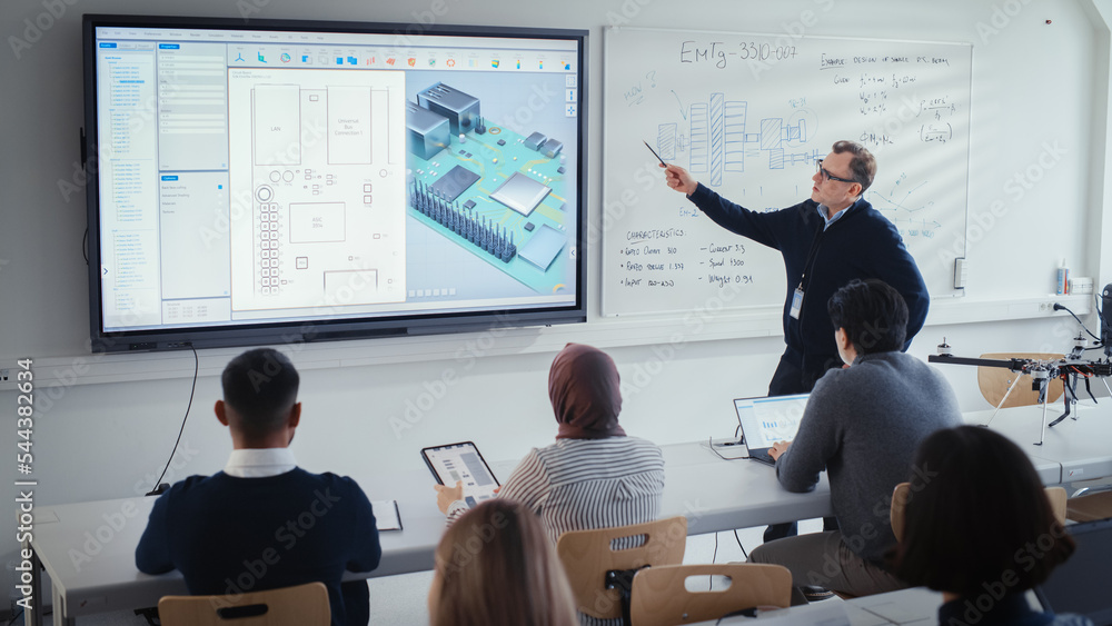 Poster male teacher explains about computer motherboard components to students during lesson at university.