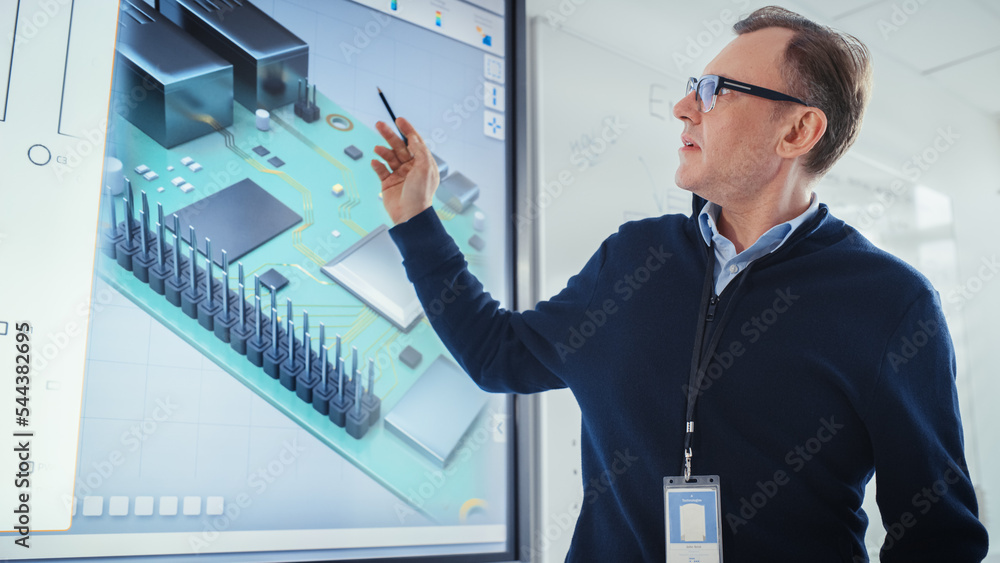 Poster male teacher stands next to digital interactive whiteboard and points at 3d model of processor durin