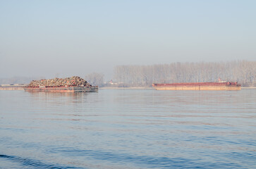 Anchored tankers with waste material. Anchored tankers with loaded waste material on the Danube River.