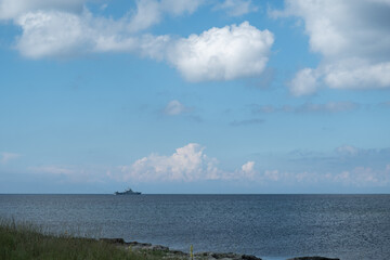 Military, patrol ship off the coast of Crimea. Limestone rocks on the shore of Cape Tarkhankut....