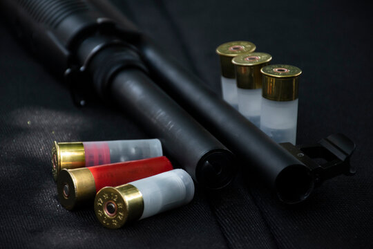 12 gauge red hunting cartridges for shotgun on wooden background.