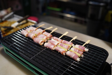 Raw meat and vegetables on skewers, ready to grill on the grill.