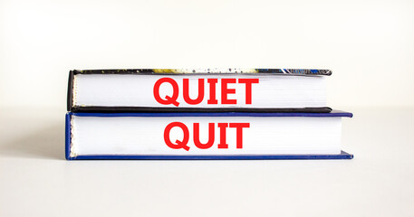 Quiet quit symbol. Concept words Quiet quit on books. Beautiful white table white background. Business and quiet quit concept. Copy space.