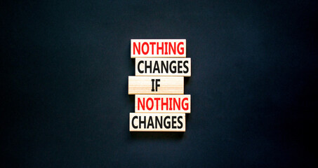 Nothing change symbol. Concept words Nothing changes if nothing changes on wooden blocks. Beautiful black table black background. Business nothing changes concept. Copy space.