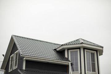 Fototapeta na wymiar New roof of house. Country house in village. Ridge roof.